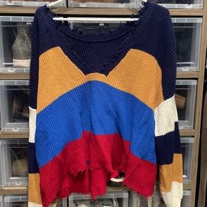 Striped cropped sweater with distressing on the edges. Size L